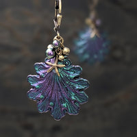 Iridescent purple and green Seashell Earrings with Antiqued Bronze Starfish charms and Pearl Clusters on top of the shells