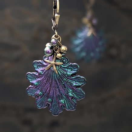Iridescent purple and green Seashell Earrings with Antiqued Bronze Starfish charms and Pearl Clusters on top of the shells