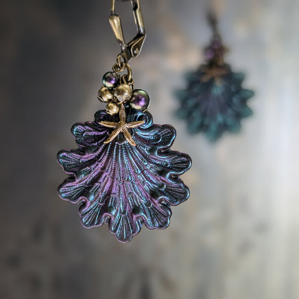 Iridescent purple and green Seashell Earrings with Antiqued Bronze Starfish charms and Pearl Clusters on top of the shells