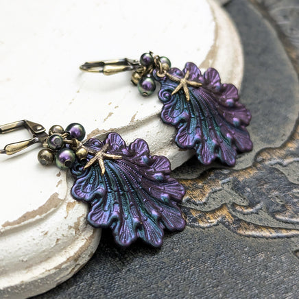 Iridescent purple and green Seashell Earrings with Antiqued Bronze Starfish charms and Pearl Clusters on top of the shells