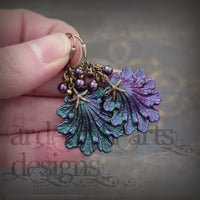 Iridescent purple and green Seashell Earrings with Antiqued Bronze Starfish charms and Pearl Clusters on top of the shells