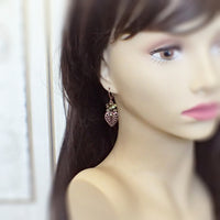 Light Green Cluster Filigree Leaf Earrings on mannequin