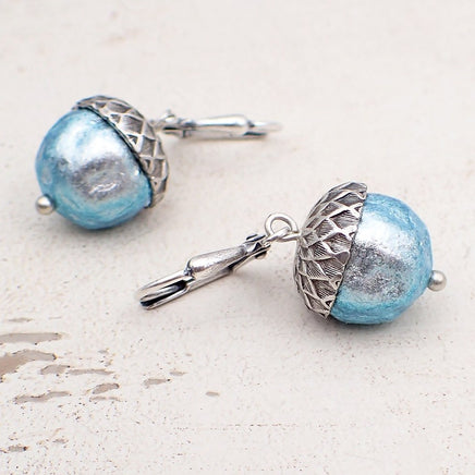 Ethereal silver and blue acorns. The glass beads are silver when viewed head on with a blue iridescence around the edges.