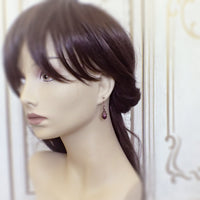 Filigree Wrapped Plum Purple and Copper Earrings mannequin view