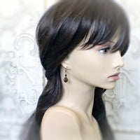 burgundy crystal earrings on mannequin