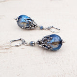 Iridescent Blue Grey Glass Teardrop Earrings with Antiqued Silver Filigree